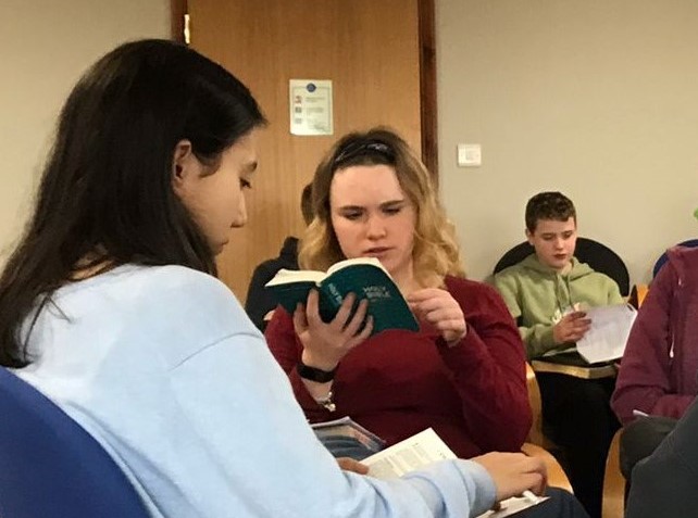 Youth group reading the Bible